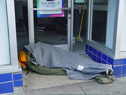 homeless under blanket