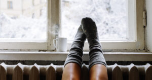 hygge relaxation feet on warm radiator