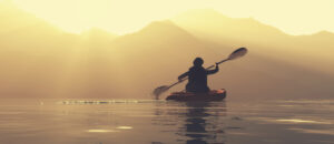paddling into sunset
