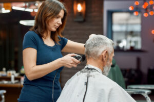 woman cutting man's hair